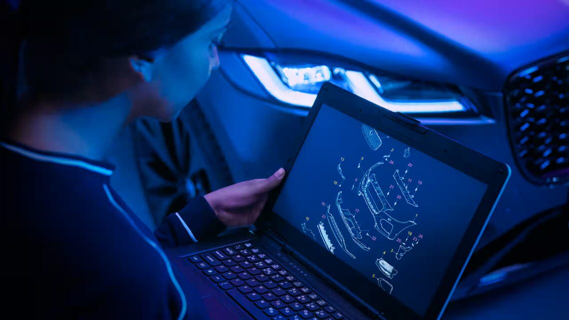 Jaguar technician with diagnostic computer