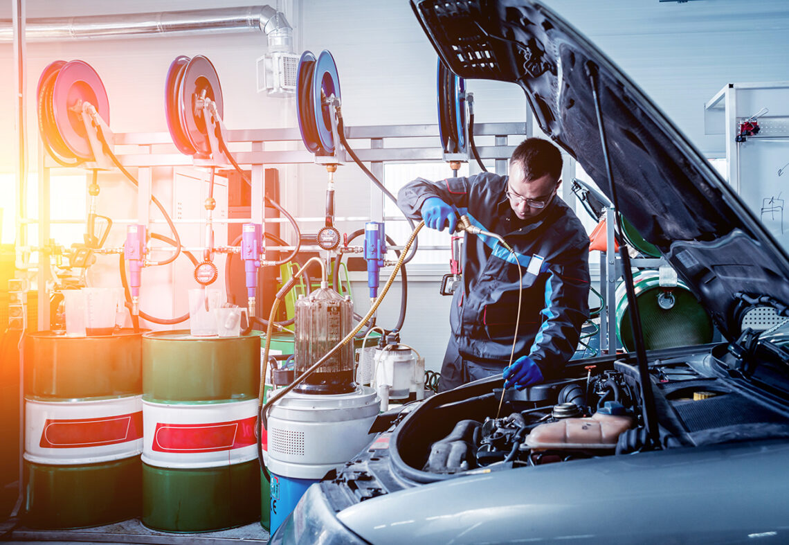 technician performing an oil change