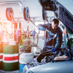 technician performing an oil change