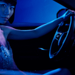 Woman behind the wheel of a new Jaguar model
